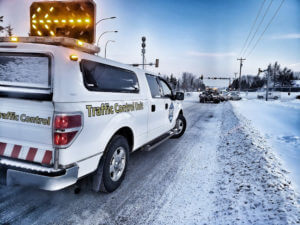 Traffic control providing a safe scene for the operator to pickup in Alberta