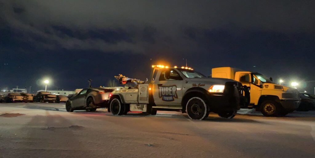 Tow truck on the road at night