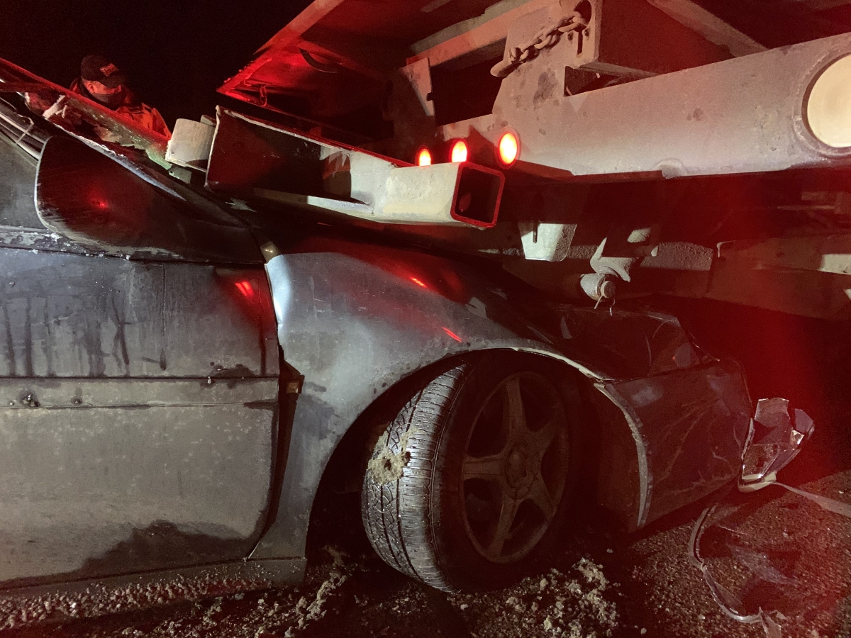 Car under truck